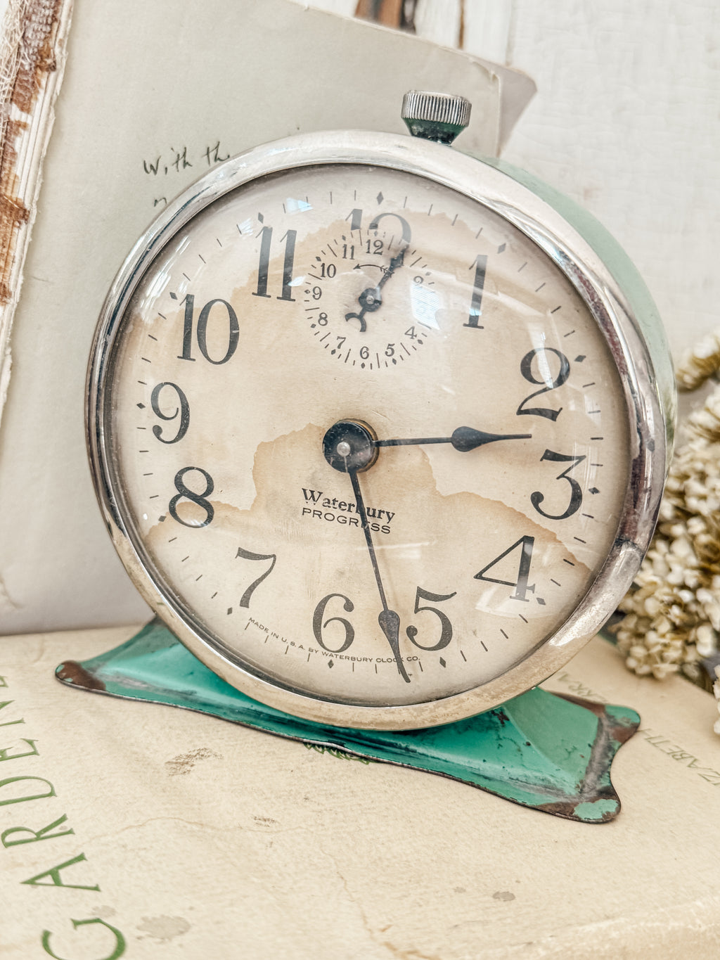 Vintage green Waterbury alarm clock